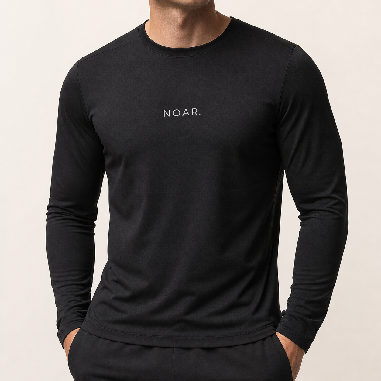 AI model wearing a black NOAR long sleeve with white chest logo